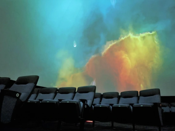 Planetarium theater with stellar clouds on the dome