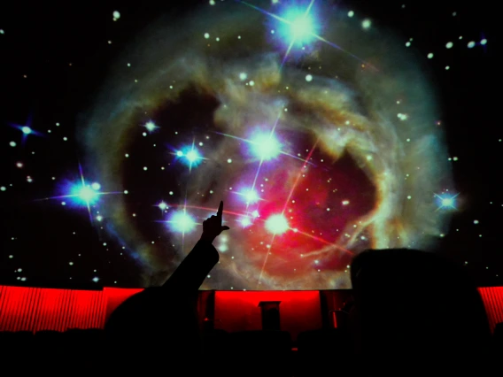 People watching a planetarium show