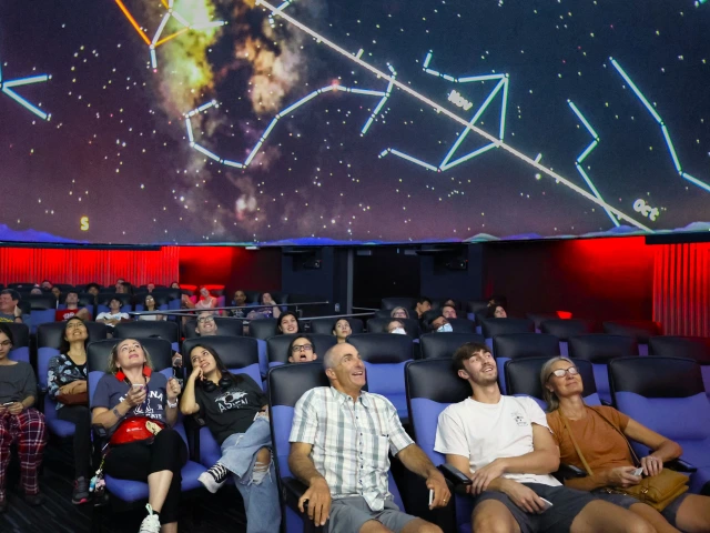 Families enjoying Flandrau planetarium show