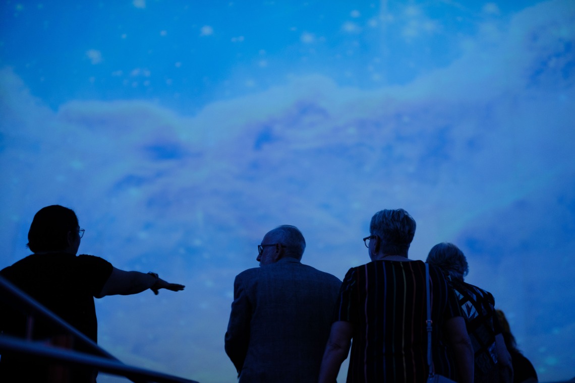 Guests being seated inside planetarium