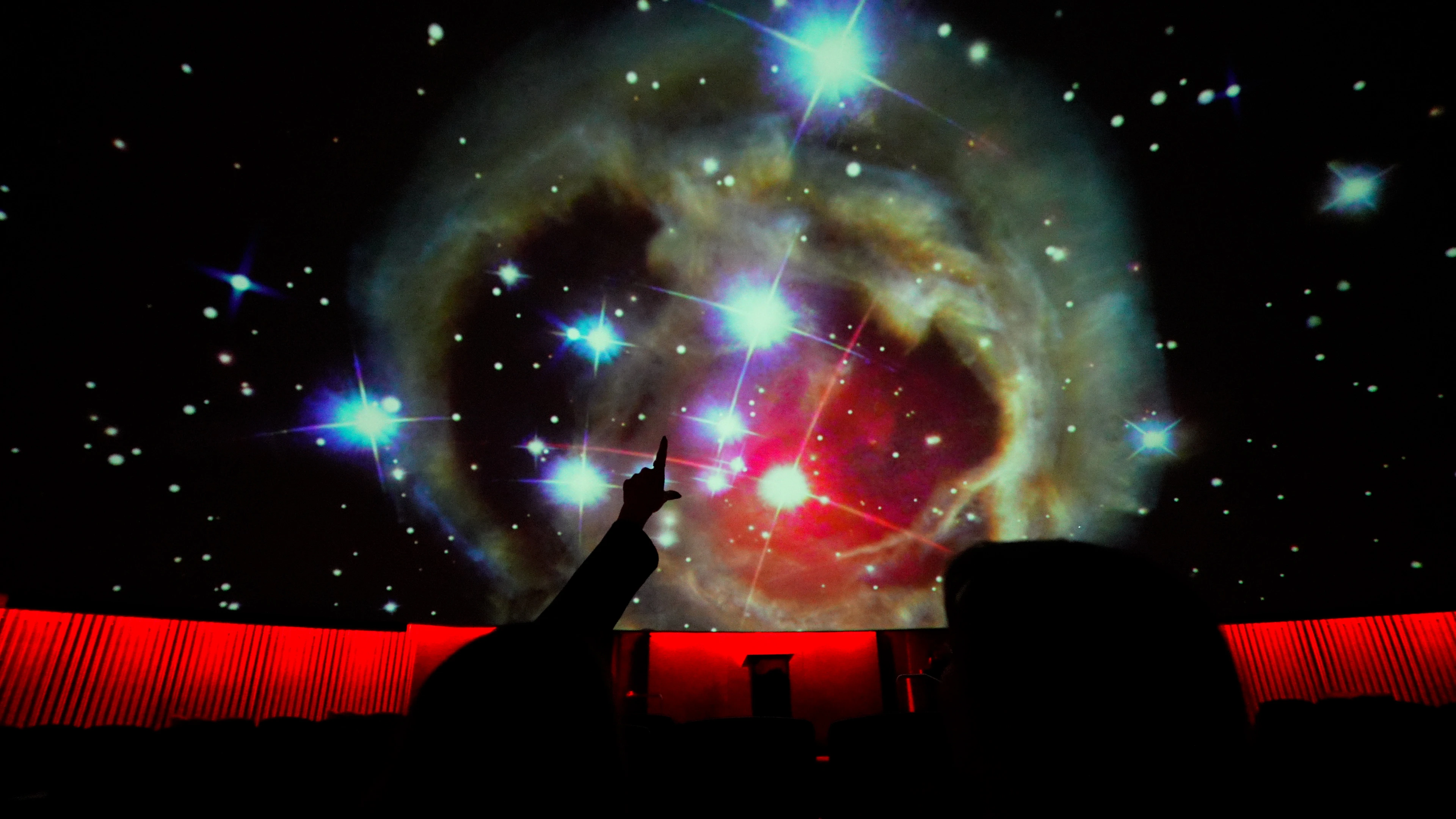 People watching a planetarium show