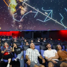 Families in Flandrau Planetarium enjoying the show